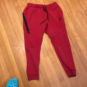 Red Nike tech sportswear pants